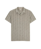 Tan short sleeve knit button down shirt with camp collar and subtle jacquard pattern, displayed flat on white background.