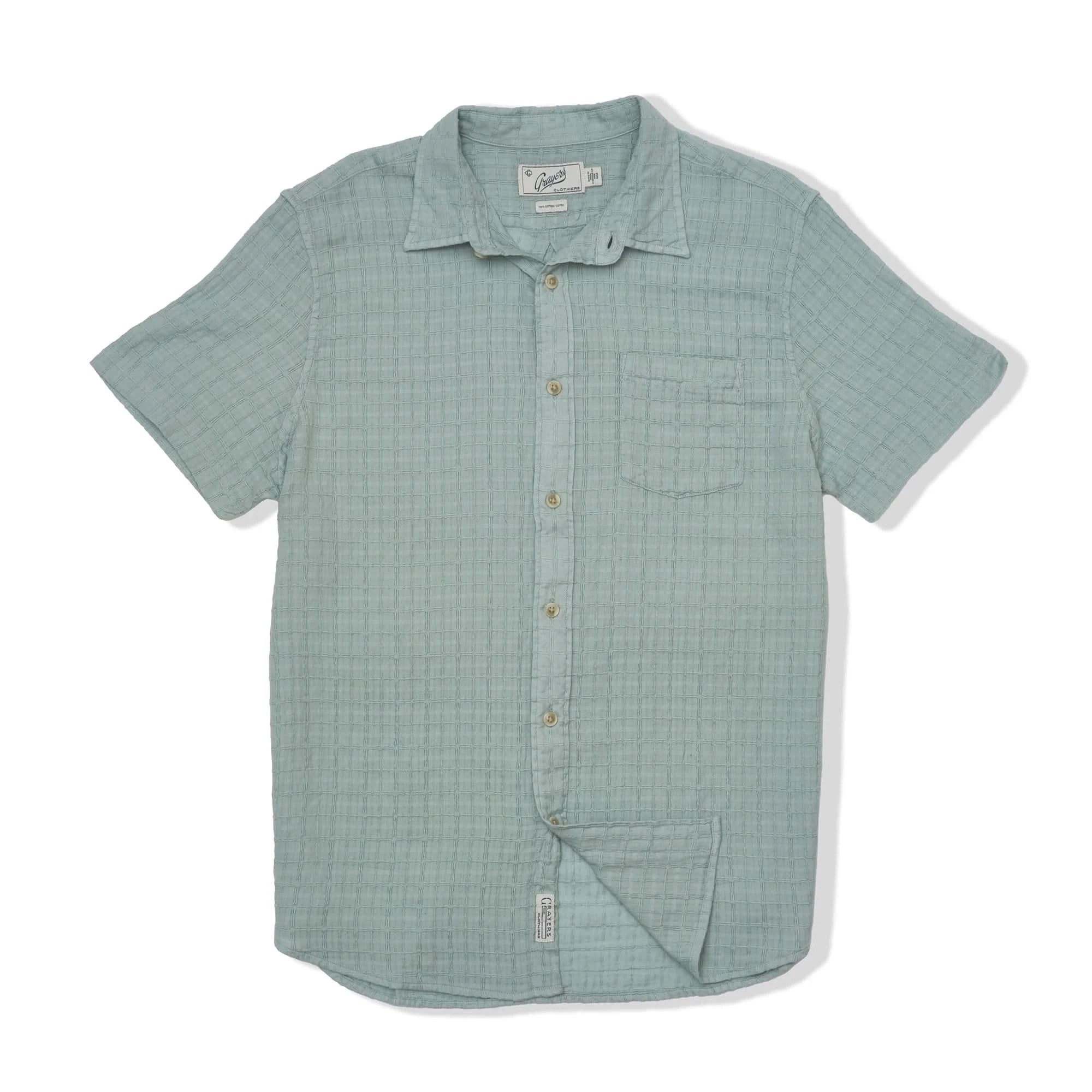 Flat lay of the Bamboo Dobby Short Sleeve Shirt in Abyss green/blue, featuring a textured dobby weave, natural buttons, and a single chest pocket.