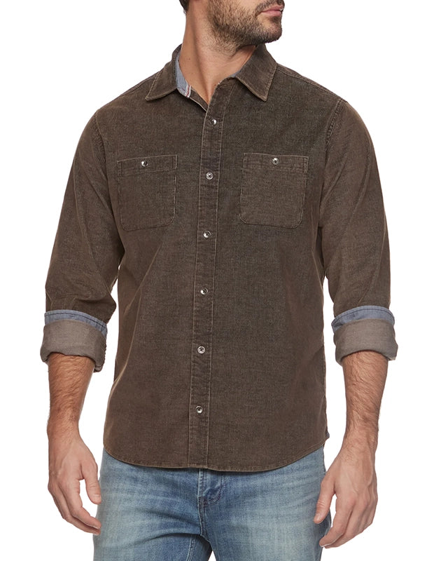 Model wearing Flag and Anthem durham stretch corduroy shirt in brown, front  view