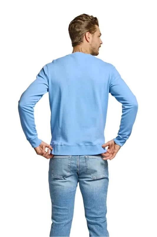 Model wearing Easy Mondays Crewneck sweatshirt in Azure color, rear view