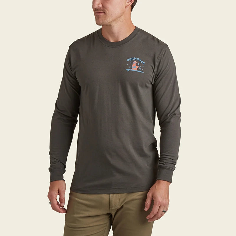 model Wearing Howler Bros. long sleeve t-shirt with ocean offerings graphic in antique black, front view