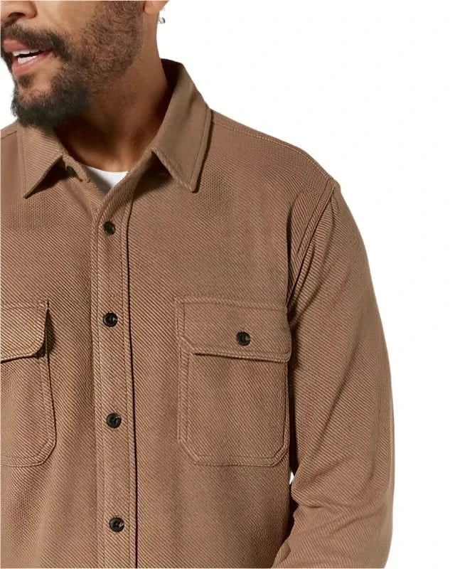 Model wearing 7 diamonds generation long sleeve shirt in cedar color, front detail view