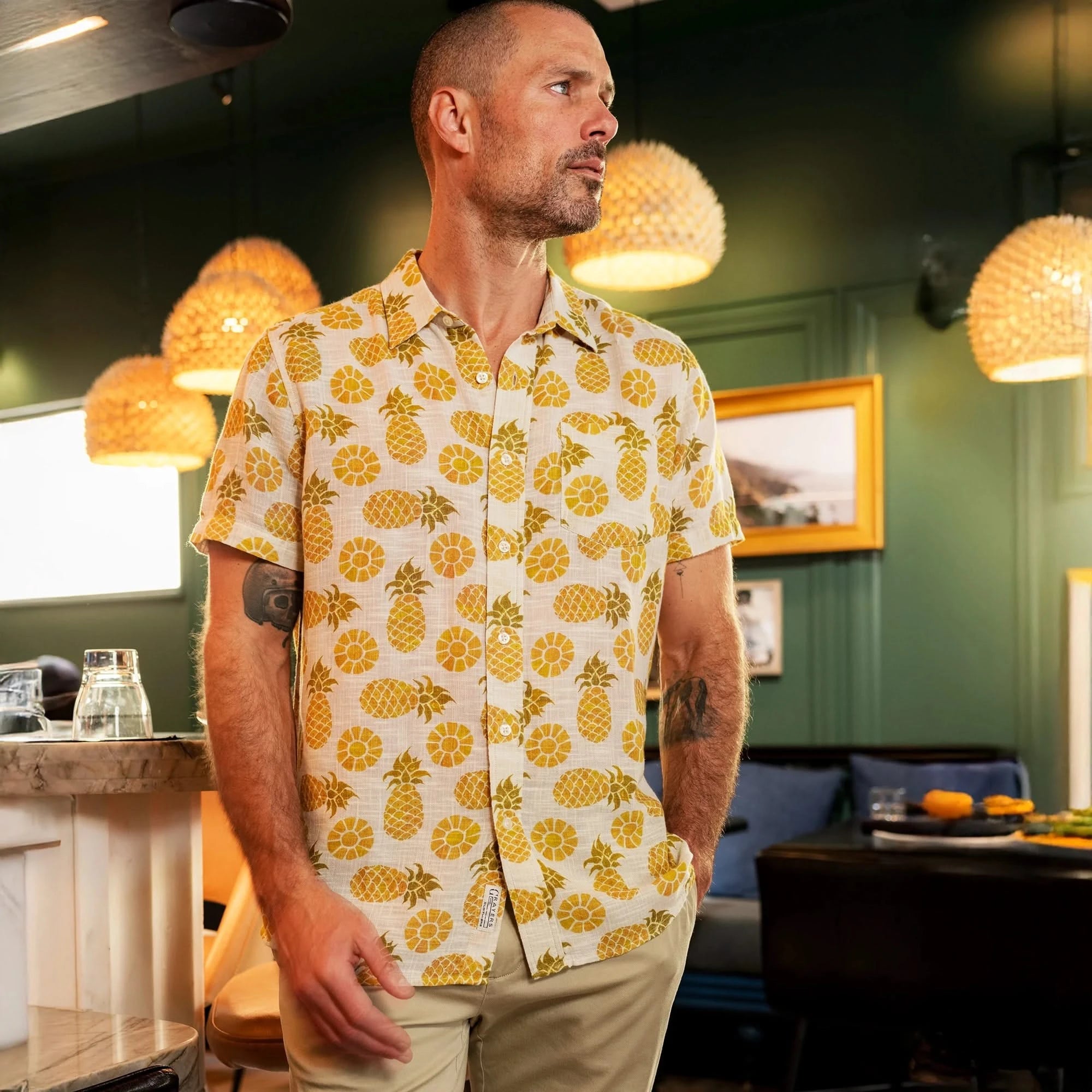 Model wearing Grayer's madras shirt with Pineapple Motif, flat lay view