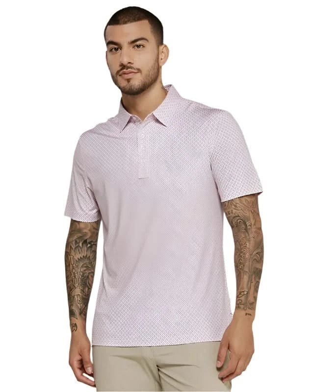 Model wearing 7 Diamonds Marquez Polo in the coral colorway, front view