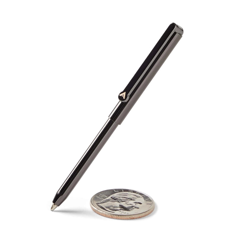 Allett micro pen in gunmetal grey next to a quarter to show size