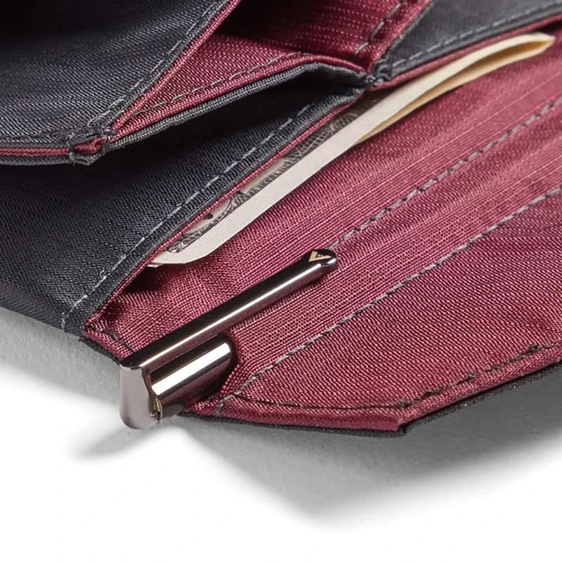 Allett micro pen in gunmetal grey shown inside a pen slot of a wallet