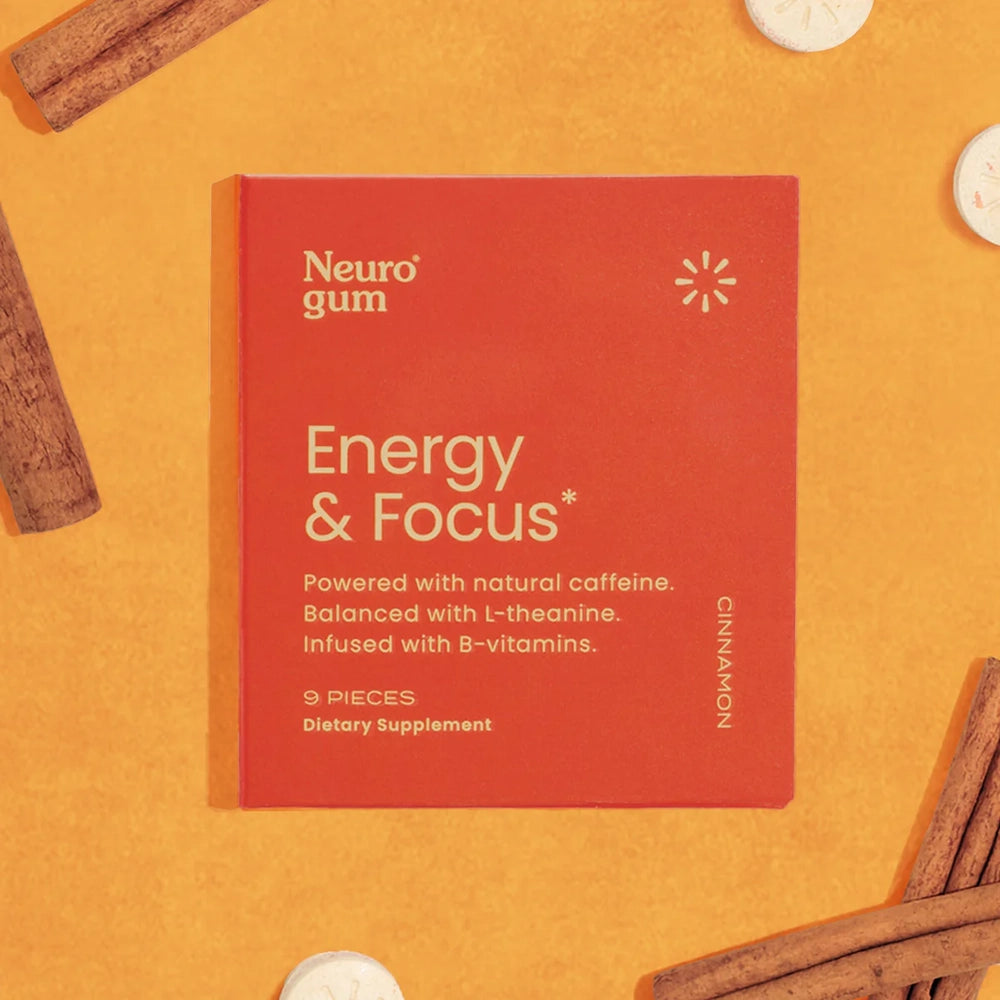Neuro Gum Energy & Focus cinnamon flavor—9-piece pack on orange background with caffeine mints and cinnamon sticks