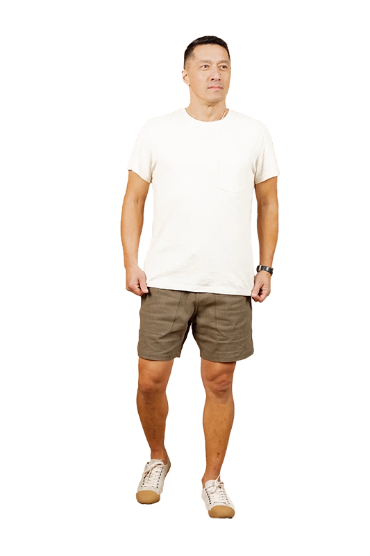 Model wearing Bridge & Burn Noah Shorts in Olive color, front view