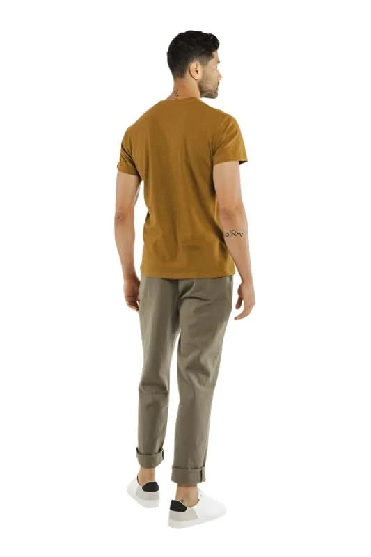 Model Wearing Bridge & Burn Organic Hemp Pocket Tee in Ochre Color, rear view