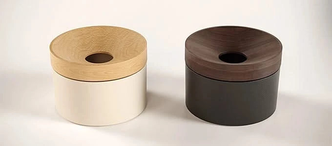 Side-by-side comparison of black and white Revov Magnetic Coin Holders with wood lids. Durable coin storage with a refined, minimalist look.