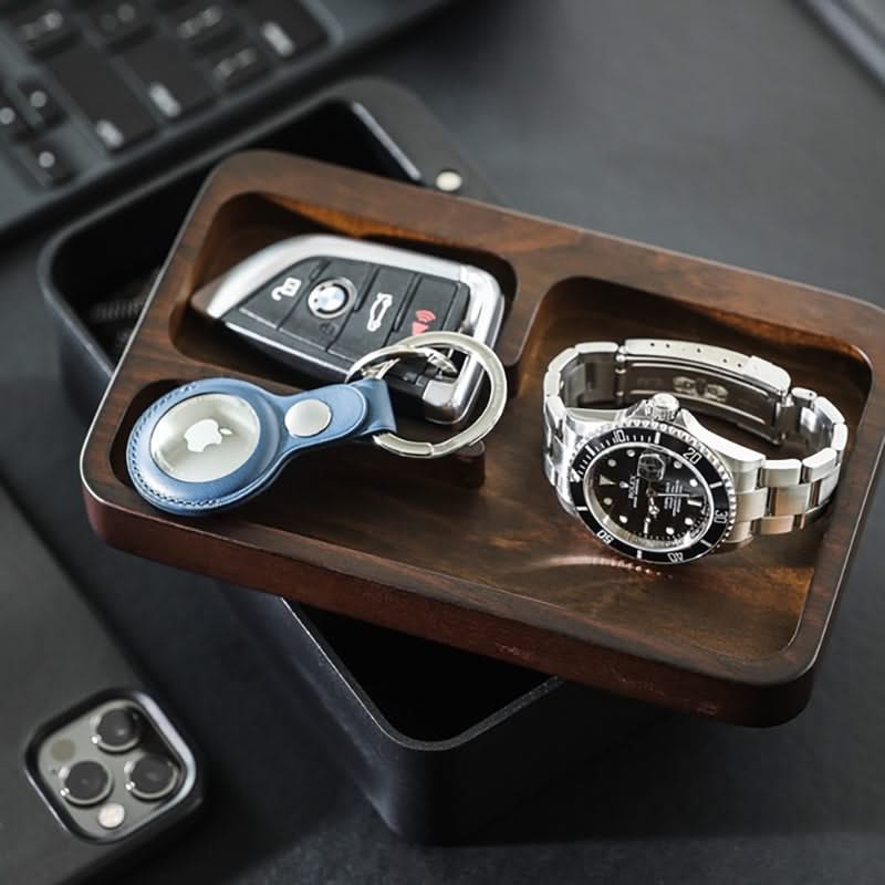 Revov Rotating Tray box in black, shown filled  with everyday carry items.
