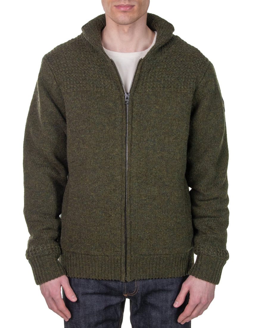 Man wearing Schott NYC moss green shawl collar wool sweater jacket, front zip, styled with jeans – rugged men's outerwear from The Simple Man