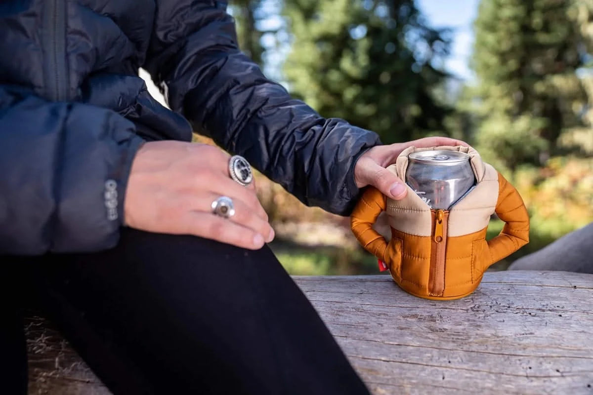 Puffin brand puffy jacket 12oz canned beverage cooler, front side view, lifestyle shot