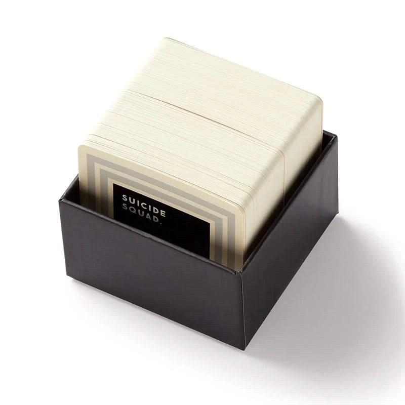 Truly Terrifying Trivia card set partially open, displaying stacked trivia cards with “Suicide Squad” category card visible – dark humor trivia gift for men.