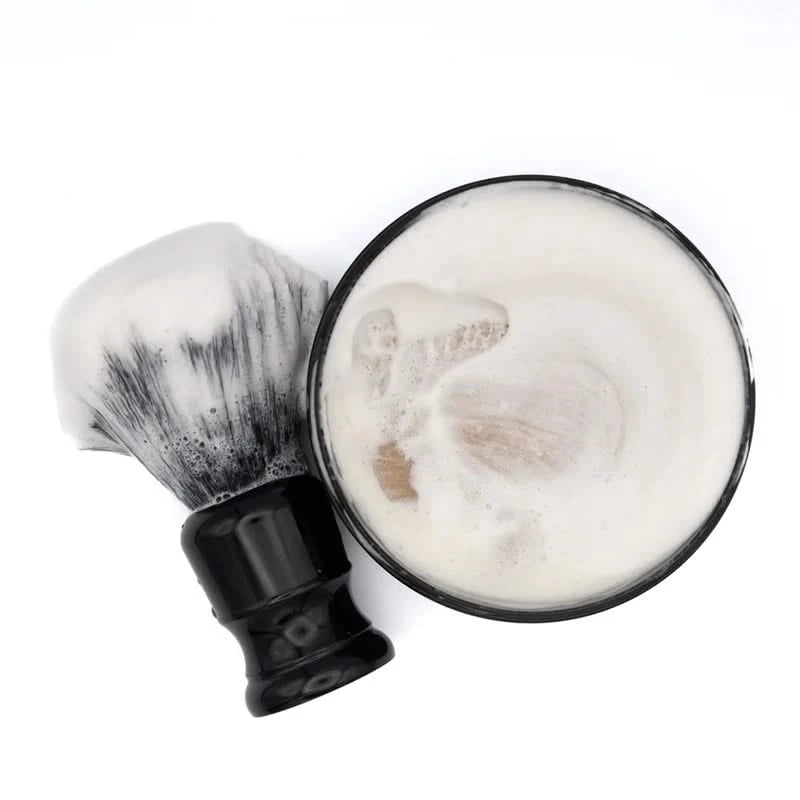 Barrister & Mann Le Grand Chypre Shave soap in the open container, with a brush, shown with a lather