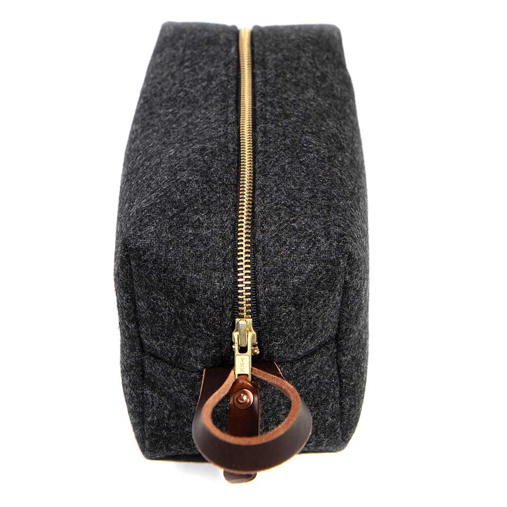 Charcoal Wool Travel Kit end view showcasing brass YKK zipper and mahogany leather loop handle