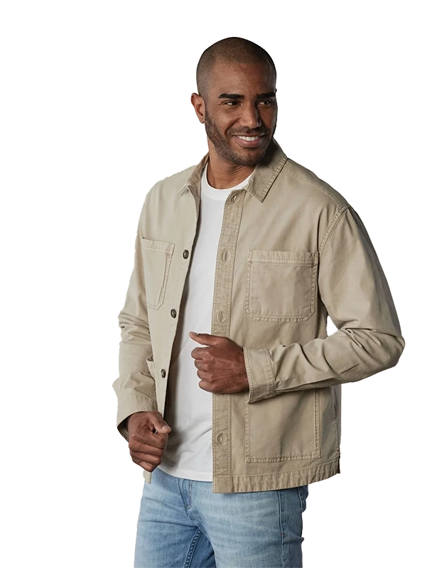 Model Wearing The Normal Brand, James Canvas Overshirt in sand dune color, Front view.