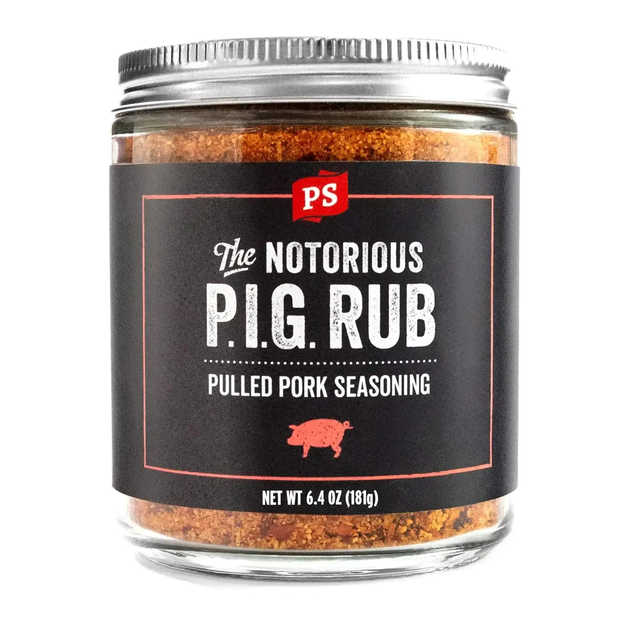 Close-up of The Notorious P.I.G. Rub pulled pork seasoning jar with bold black label, red pig icon, and metal lid. 6.4oz glass jar of premium BBQ pork rub.