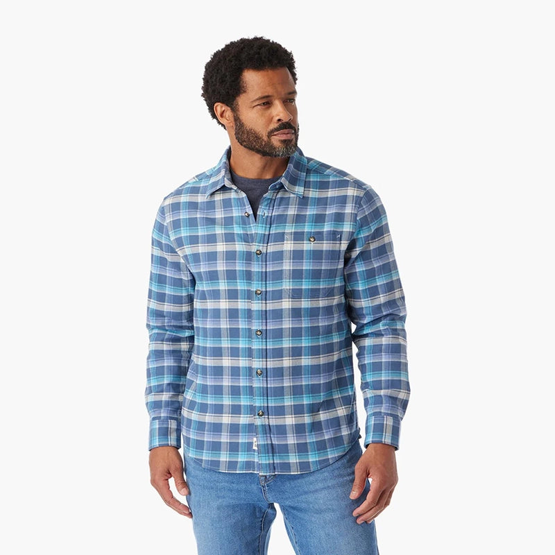 Model wearing Fair Harbor Seaside flannel in blue waves color, Front view