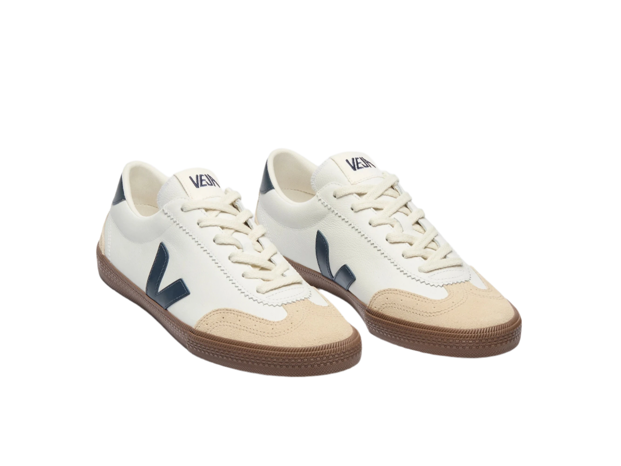 FRONT ANGLED view of VEJA Volley men's sneakers in white organic leather with navy logo, tan suede accents, and brown rubber sole – available at The Simple Man."