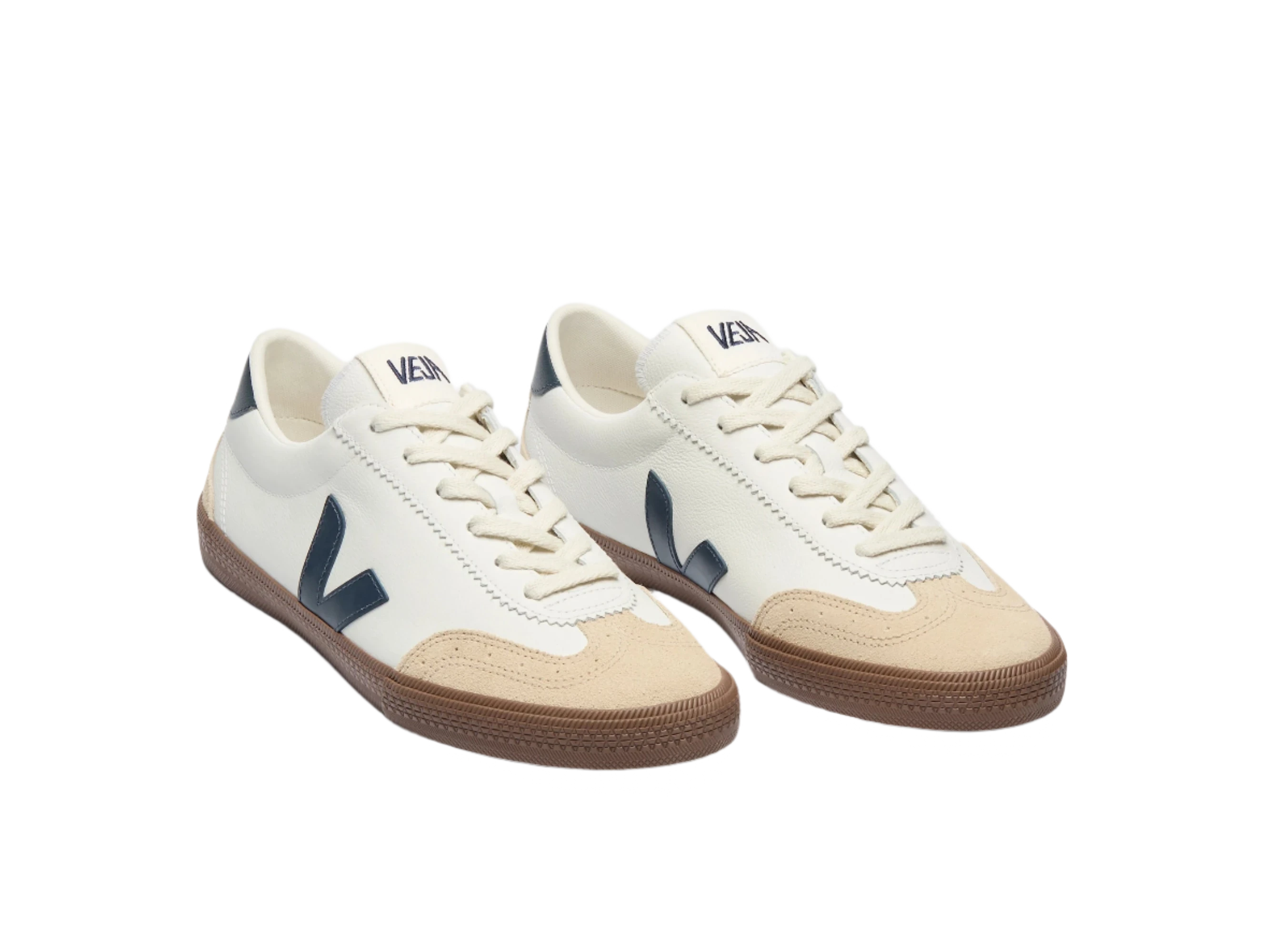 FRONT ANGLED view of VEJA Volley men's sneakers in white organic leather with navy logo, tan suede accents, and brown rubber sole – available at The Simple Man."