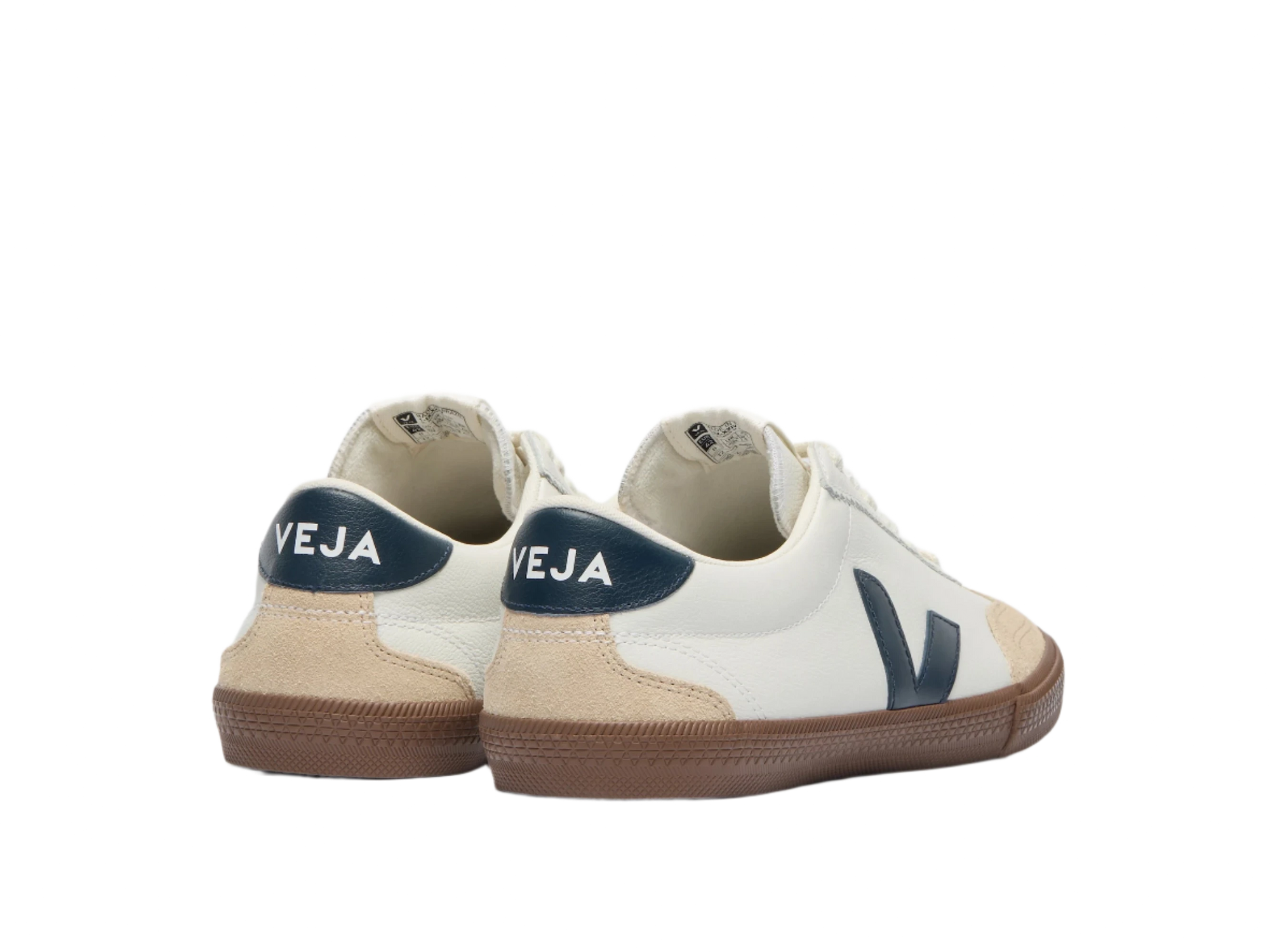 Rear angle of VEJA Volley sneakers showing navy heel tabs with VEJA branding, tan suede heel detail, and white leather upper – men's sustainable shoes from The Simple Man."