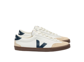 Side view of VEJA Volley men's sneakers in white organic leather with navy logo, tan suede accents, and brown rubber sole – available at The Simple Man."