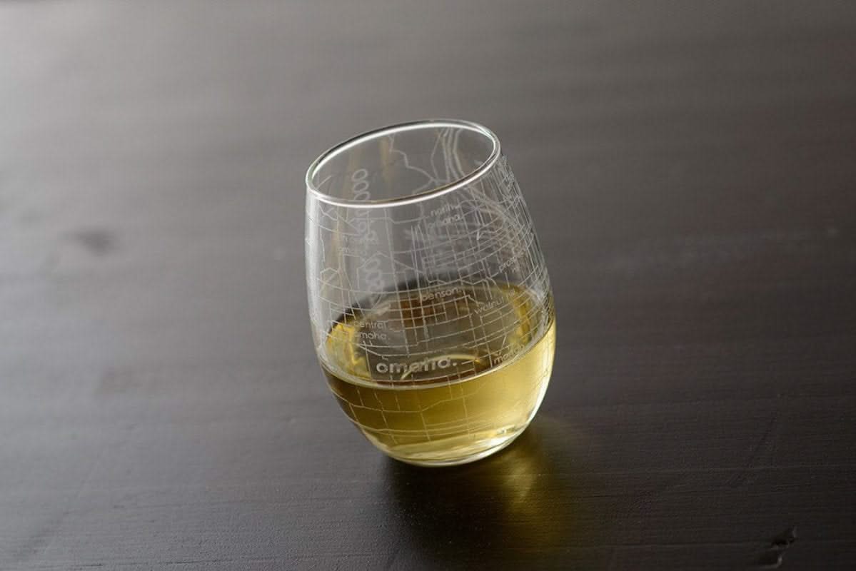 Well Tod brand stemless wine glass with omaha map etched in it