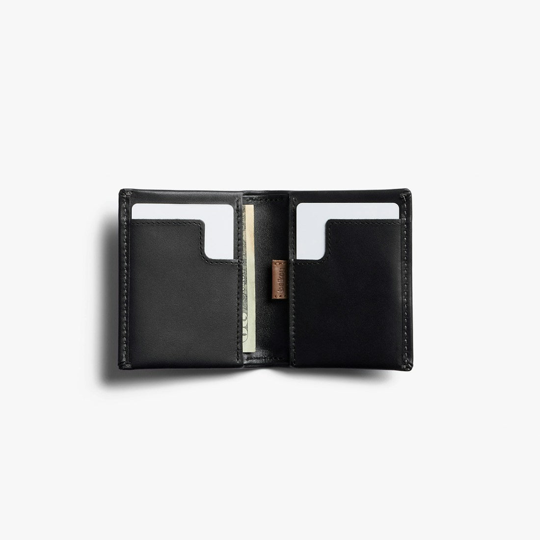 Bellroy Slim Sleeve wallet in Black, open bi-fold showing card slots and cash slot - The Simple Man