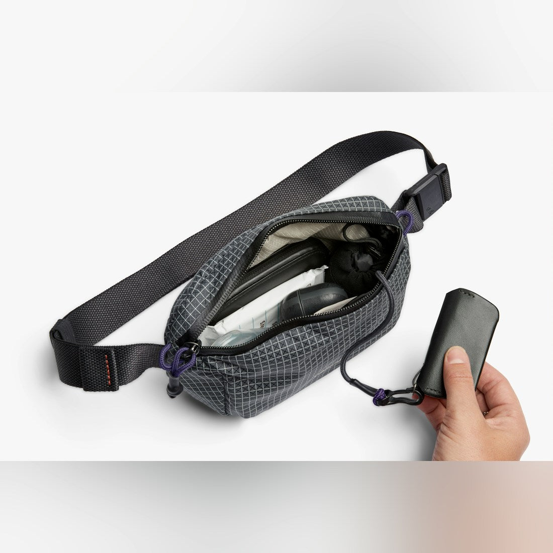 Bellroy Lite Belt Bag in Arcade Grey, open showing interior and pocket - The Simple Man