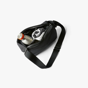Bellroy Venture Sling 6L in Black, worn across the body - The Simple Man