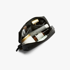 Bellroy Toiletry Kit in Black, open with toiletries inside - The Simple Man