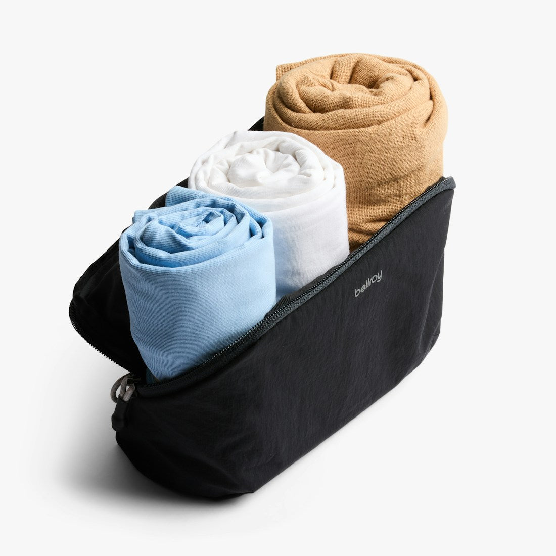 Bellroy Lite Packing Pouch 3L in Black, open with folded clothes inside - The Simple Man