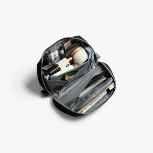 Bellroy Toiletry Kit Plus travel toiletry bag in Black, open with toiletries inside - The Simple Man