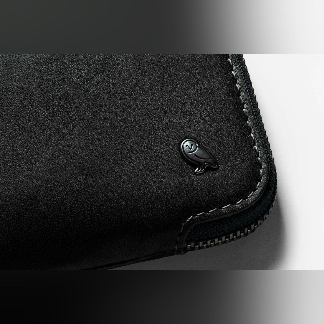 Bellroy Card Pocket wallet in Black, close-up of embossed logo and stitching - The Simple Man
