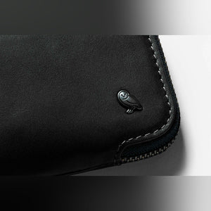 Bellroy Card Pocket wallet in Black, close-up of embossed logo and stitching - The Simple Man