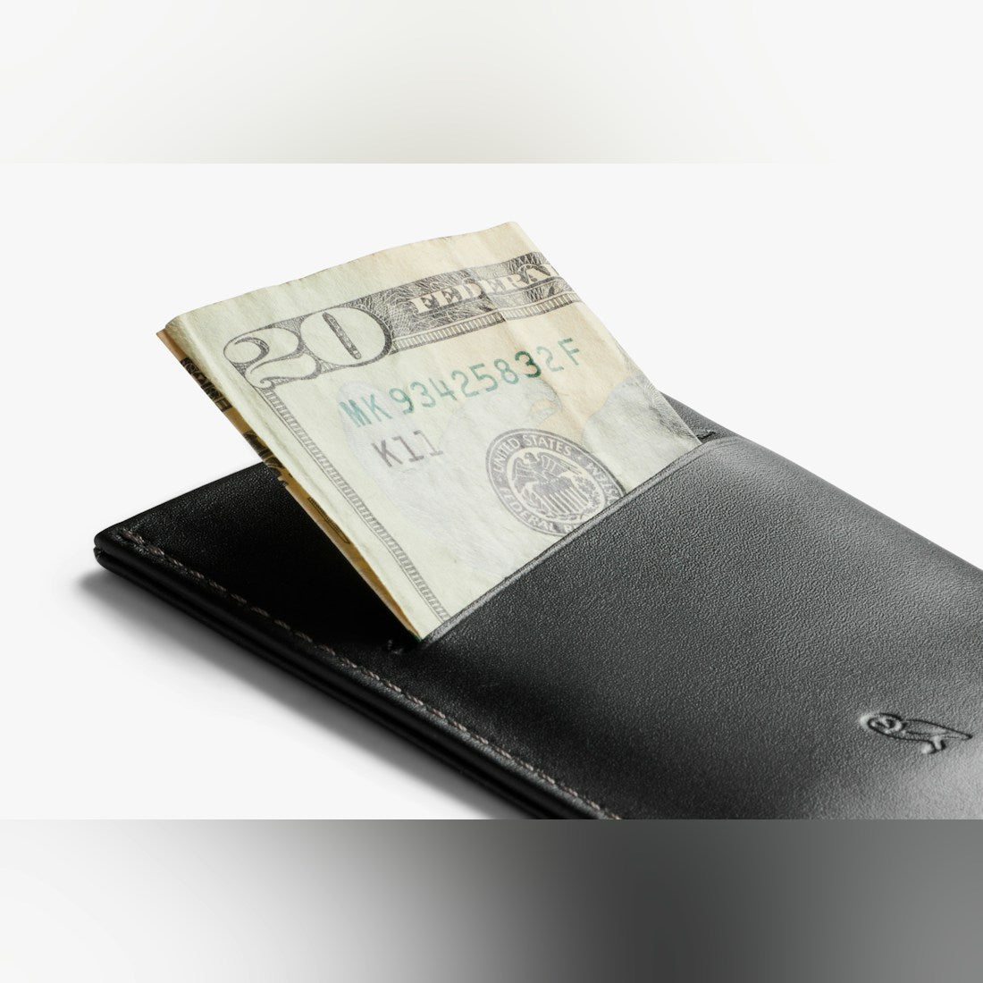 Bellroy Card Sleeve wallet in Black, holding folded cash in the back slot - The Simple Man
