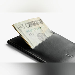 Bellroy Card Sleeve wallet in Black, holding folded cash in the back slot - The Simple Man
