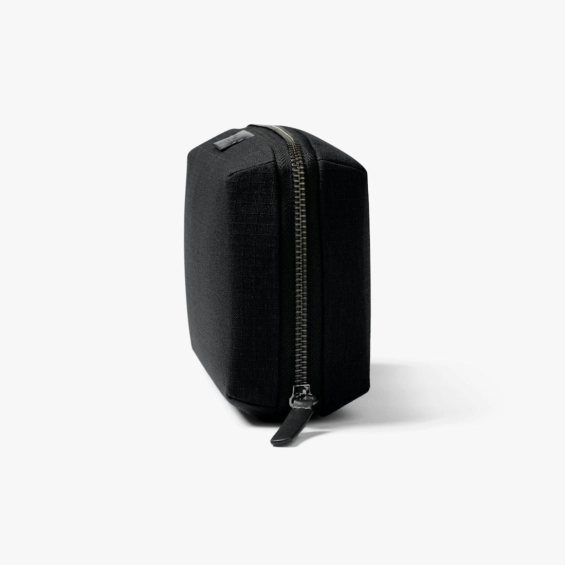 Bellroy Tech Kit cable organizer in Black, closed, standing upright, side view - The Simple Man