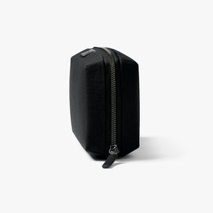 Bellroy Tech Kit cable organizer in Black, closed, standing upright, side view - The Simple Man