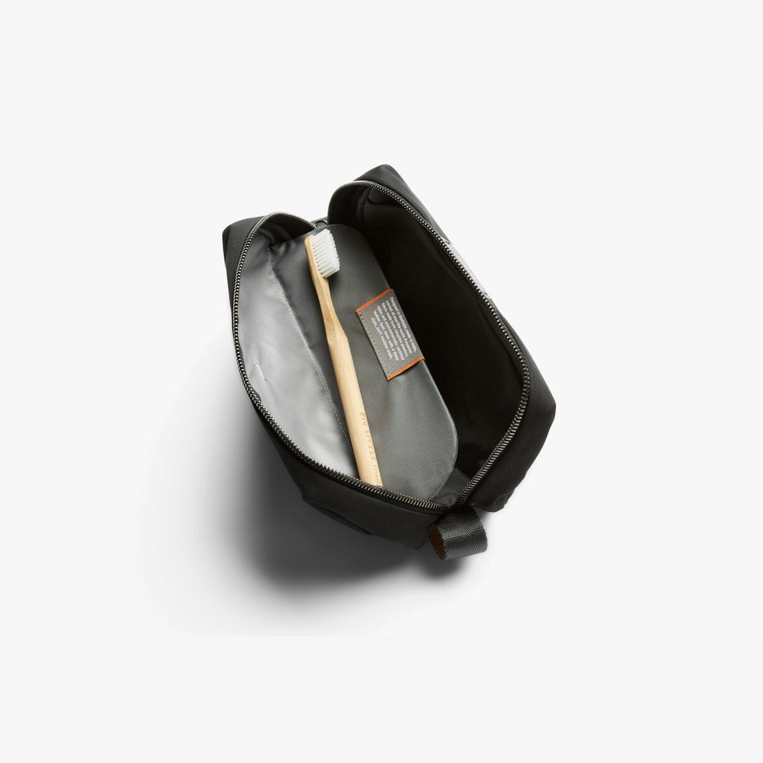 Bellroy Toiletry Kit in Black, open showing toothbrush storage - The Simple Man