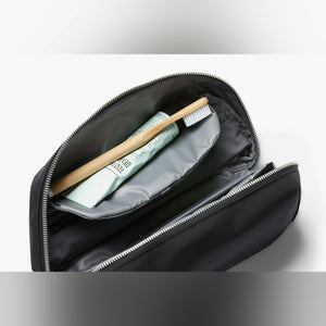 Bellroy Toiletry Kit Plus travel toiletry bag in Black, open showing toothbrush storage - The Simple Man