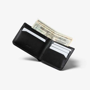Bellroy Hide & Seek RFID leather wallet in Black, open with cash in the bill compartment and cards in the slots - The Simple Man