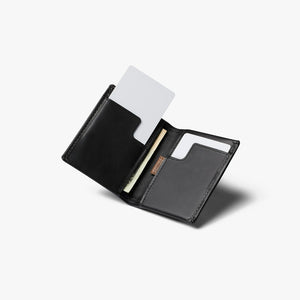 Bellroy Slim Sleeve wallet in Black, open at an angle with a card pulled up - The Simple Man