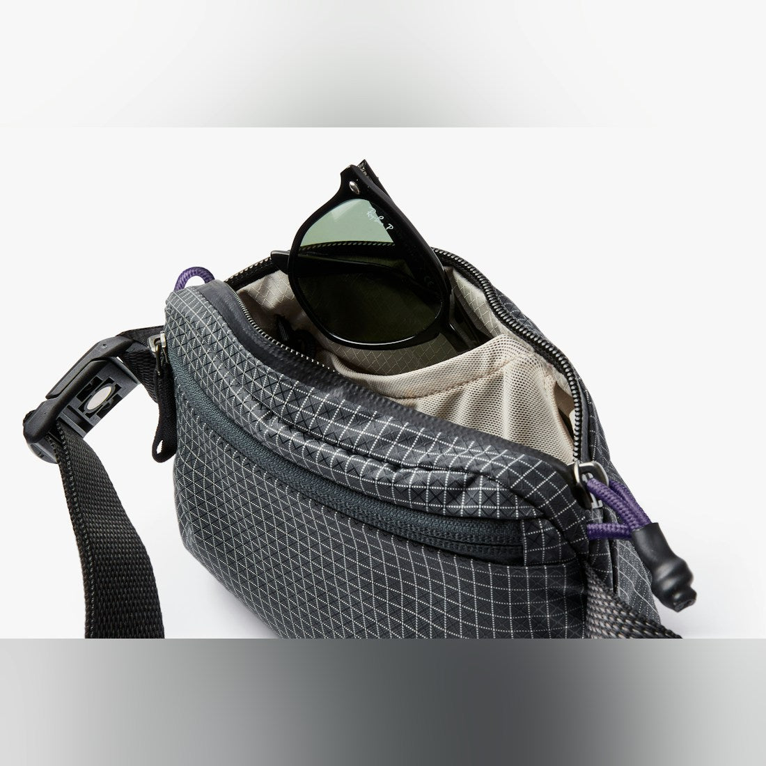 Bellroy Lite Belt Bag in Arcade Grey, open with contents - The Simple Man