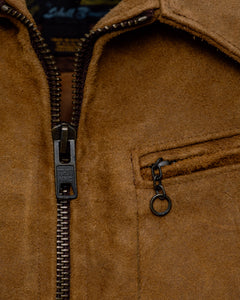 Close-up of the zip front, shirt collar and zippered chest pocket with chain pull on the brown suede jacket - The Simple Man