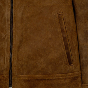 Close-up of the lower front pocket and zipper on the brown rough-out suede jacket - The Simple Man