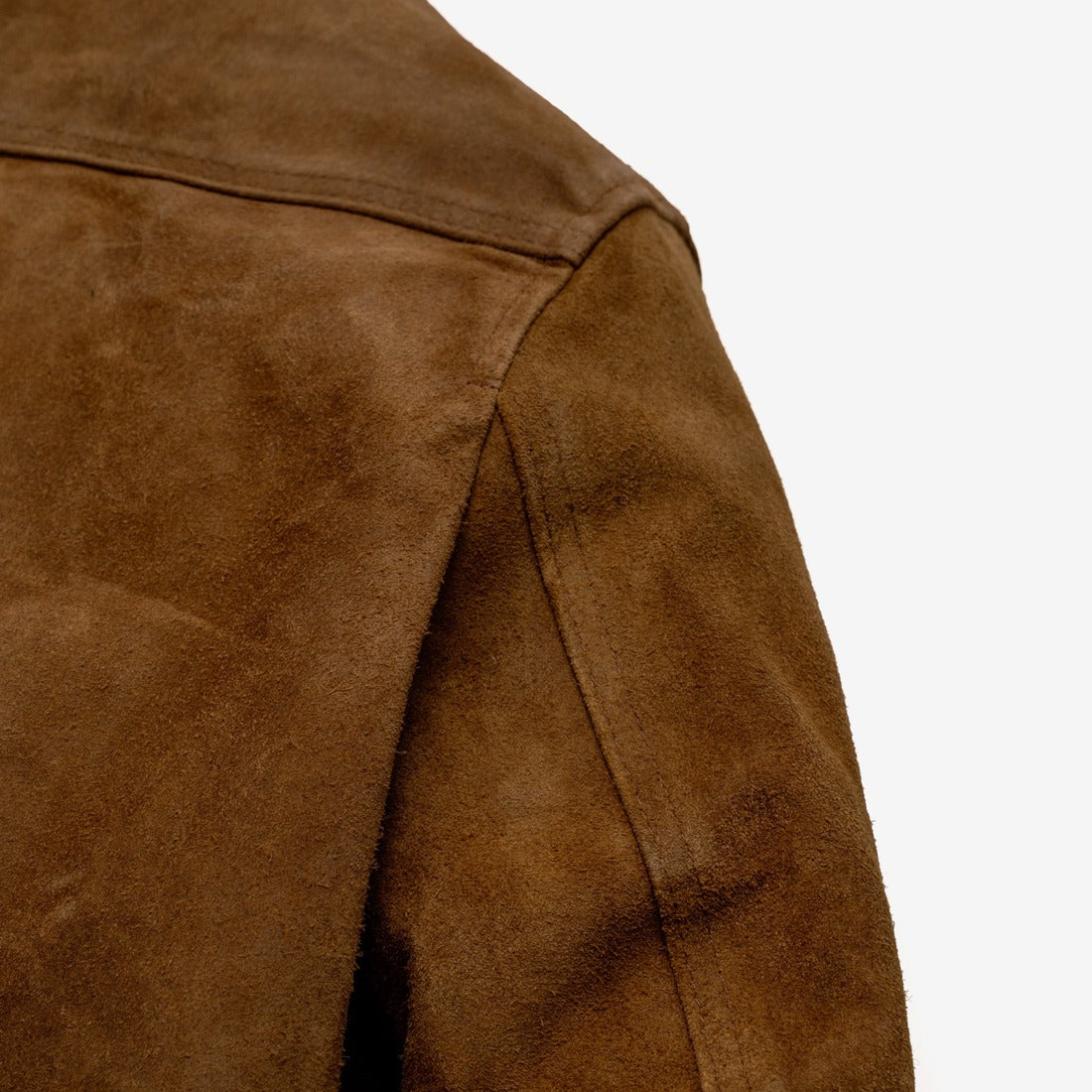 Close-up of the shoulder and sleeve seam on the brown rough-out suede jacket - The Simple Man