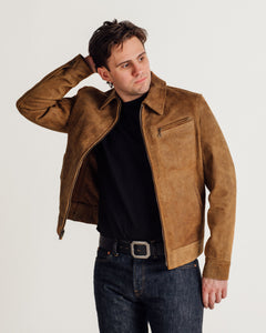 Man wearing the brown rough-out suede jacket open over a black tee and dark jeans - The Simple Man
