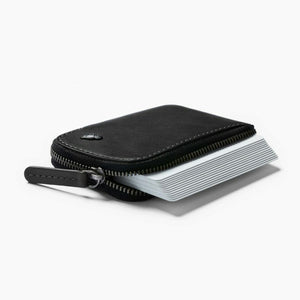 Bellroy Card Pocket wallet in Black, zip pocket holding a stack of cards and a coin - The Simple Man